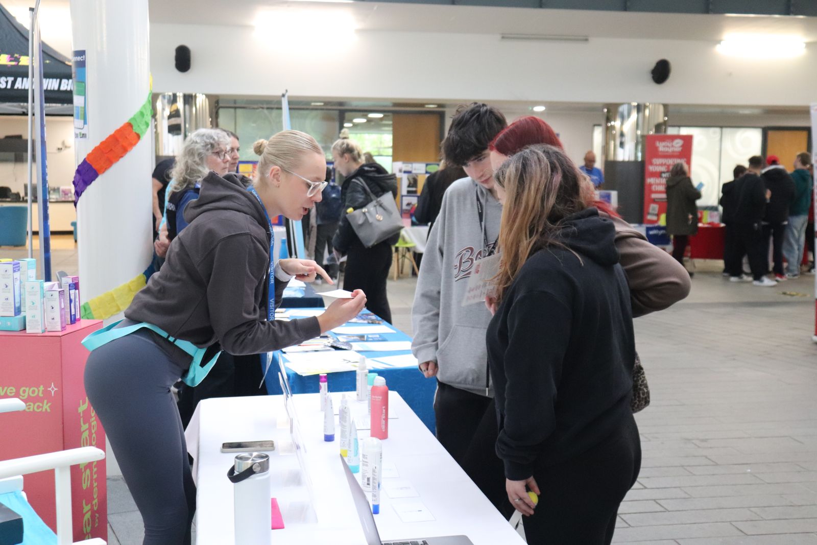 Students speaking with Dermalogica rep